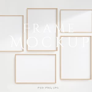 May include: A mockup of four frames against a white background. The frames are all the same size and have a light wood finish. The text "FRAME MOCKUP" is written in white letters on the wall.