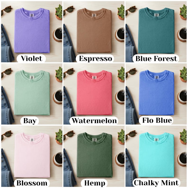 May include: Nine different solid-color t-shirts are displayed, including violet, espresso, blue forest, bay, watermelon, flo blue, blossom, hemp, and chalky mint. Each shirt is folded and presented with jeans, sunglasses, a coffee cup, and a small plant.