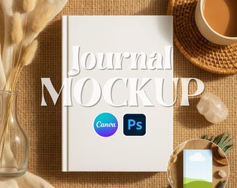 May include: A white journal mockup with the text "Journal MOCKUP" and the Canva and Ps logos. The image includes a cup of coffee, a small decorative journal, a vase with dried flowers, and a crystal on a textured, tan surface. The file formats are JPG, PNG, and PSD.