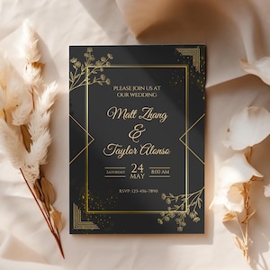 May include: A black wedding invitation with gold lettering and floral accents. The invitation reads "Please join us at our wedding, Matt Zhang & Taylor Alonso, Saturday, May 24, 8:00 AM, RSVP: 123-456-7890".