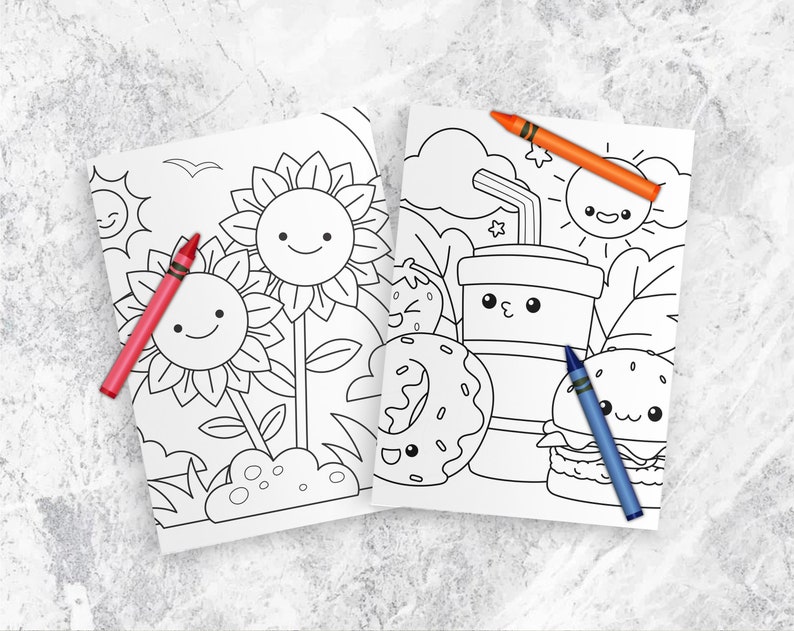 以下が含まれることがあります： ひまわり、ドーナツ、カップ、ハンバーガー、太陽の白黒イラストが描かれた塗り絵2枚。ページは白のテクスチャ加工された表面に、赤、オレンジ、青のクレヨンと一緒に置かれています。
