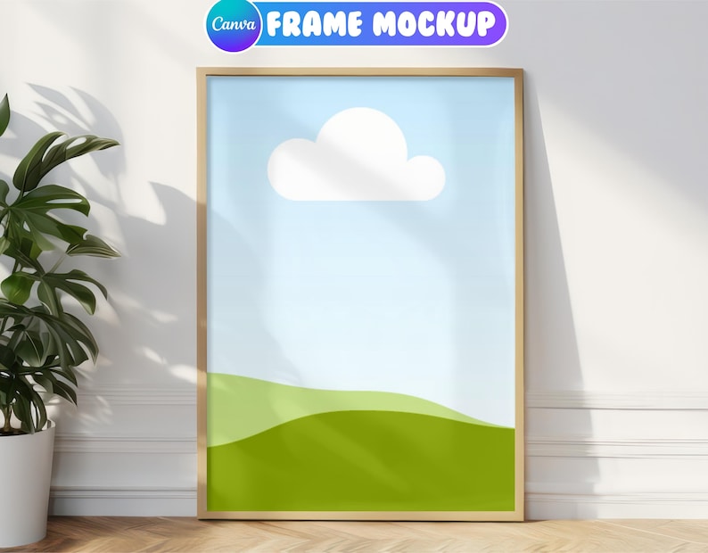 May include: A gold frame mockup with a simple landscape design. The design features a white cloud against a light blue sky and a green grassy field.