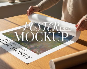 May include: A poster mockup featuring a Monet painting, with the text "Poster Mockup" overlaid. The poster is being unrolled on a wooden table, with a rolled-up poster tube visible. The painting is of water lilies.