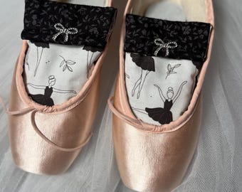 Pointe Shoe Dryer *breeze scented.  Black and white ballerinas with bow chatms.