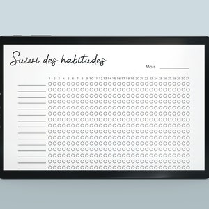 May include: A digital tablet displaying a habit tracker with the French words "Suivi des habitudes" and "Mois" at the top. The tracker has 30 columns representing days of the month and 10 rows for different habits. Each day is represented by a circle that can be filled in to indicate completion of a habit.