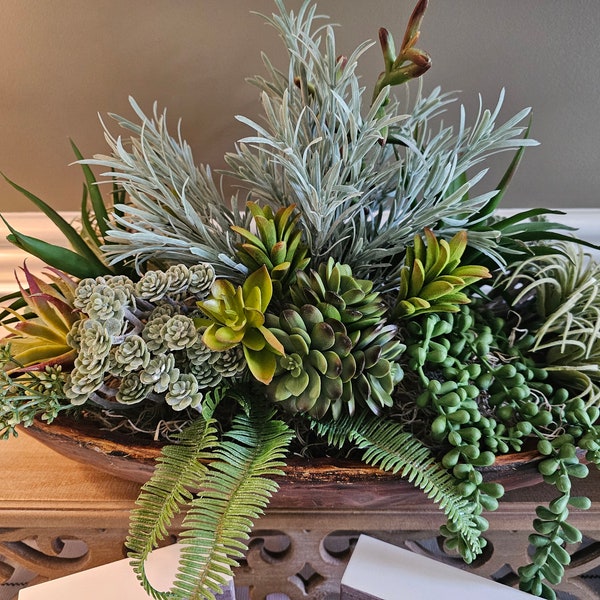 Large succulent centerpiece in wood shallow bowl