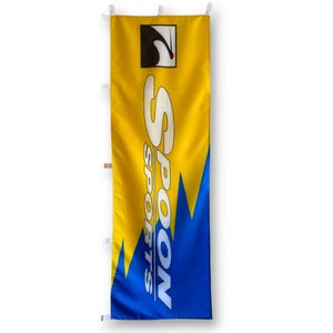 May include: A yellow and blue banner with the text "SPOON SPORTS" in white. The banner has a white logo of a stylized bird in the top left corner.