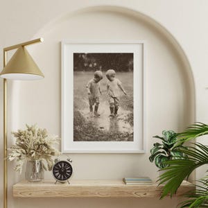 Vintage B&W Photo of Toddlers Splashing in Mud Puddles | Playful Childhood Digital Download