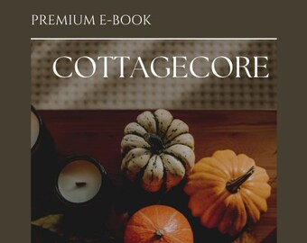 Könnte beinhalten: Ein Buchcover mit dem Titel "Cottagecore" in weißer Schrift auf braunem Hintergrund. Das Cover zeigt ein Stillleben mit Kürbissen und Herbstlaub auf einem Holztisch. Der Text unter dem Titel lautet: "Eine Einführung, die Ursprünge und wie man alles Cottagecore annimmt."