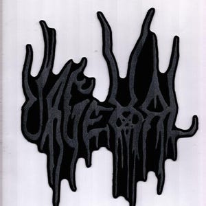 May include: A black and gray embroidered patch with the word "URGEHAL" in a stylized, dripping font. The patch has a textured appearance and is likely designed for application on clothing or accessories. The design is set against a white background.