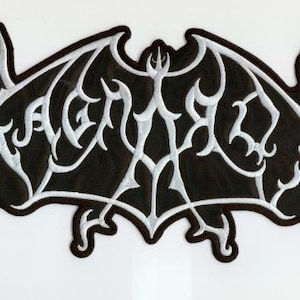 May include: Black and white embroidered patch with a stylized design. The patch features a black background with a white, intricate, and ornate design. The design has a bat-like shape with the word "DEATH" in the center.