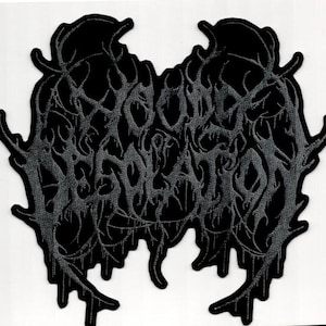 May include: Black embroidered patch featuring the words "Beyond Salvation" in a gothic font. The patch has a dark grey border and the text is in a lighter grey colour. The design has a distressed, textured appearance.