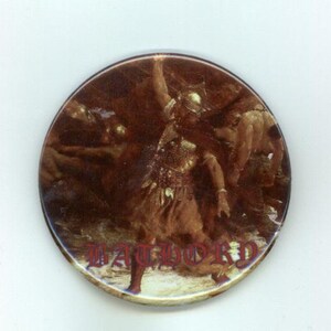 May include: Round button with a brown and tan illustration of a battle scene. The word "BATHORY" is printed in red at the bottom of the button. The image depicts figures in armor, with one raising a weapon.