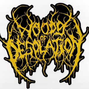 May include: A black patch featuring yellow embroidered text reading "DOOM DESECRATION". The text is in a gothic style, framed by a yellow, organic border. This patch is designed for application on clothing or accessories.