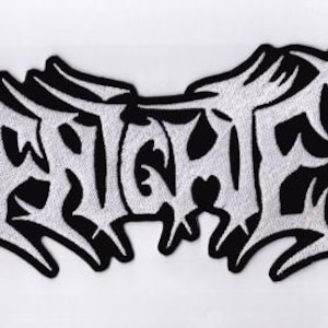 May include: Embroidered patch with the word "BRUTALIZED" in a stylized, gothic font. The text is in white thread, outlined in black, against a black background. The patch has a jagged, irregular shape.