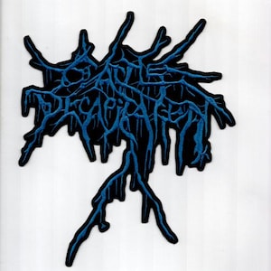 May include: Black patch with blue embroidered text that reads "DECAPITATED" in a stylized, dripping font. The design features a dark, organic shape with blue, vein-like details.