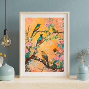 May include: A framed print of a painting featuring five colorful birds perched on a blooming tree branch with pink flowers. The birds are a mix of blue, green, yellow, and orange. The background is a soft orange.