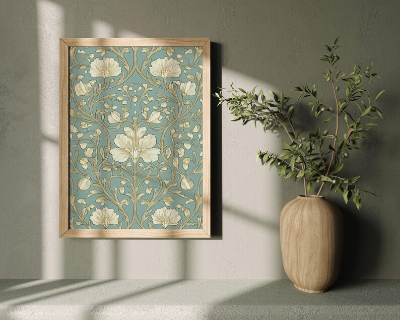 May include: A framed print of a vintage floral pattern with white flowers and green leaves on a blue background.