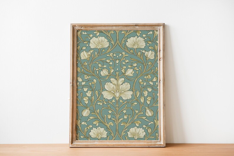 May include: A framed print with a vintage floral pattern. The design features white flowers with gold accents on a teal background.