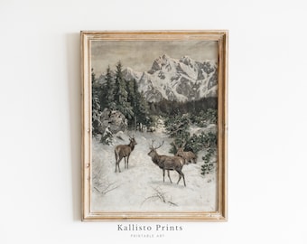 Puede incluir: Una impresión enmarcada vintage de un paisaje montañoso nevado con tres ciervos en primer plano. La impresión está en un marco de madera claro con un fondo blanco.