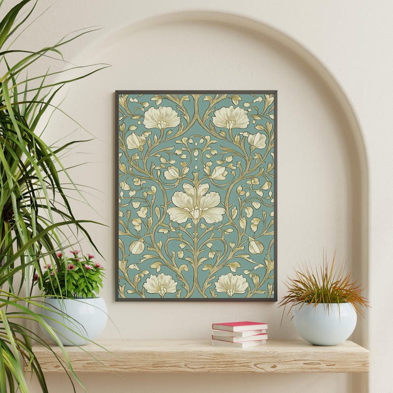 May include: A framed print of a vintage floral pattern with a blue background and gold accents. The pattern features stylized flowers and leaves.