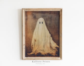 Puede incluir: Una impresión de estilo vintage de un fantasma blanco con dos ojos negros en un marco de madera marrón. La impresión tiene un aspecto desgastado y envejecido. "Kallisto Prints" está impreso debajo del marco.