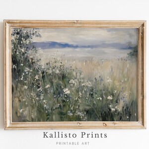 May include: A framed painting of a landscape with a field of white flowers in the foreground and a hazy blue sky and water in the background.