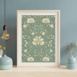 May include: A framed print of a vintage floral pattern with white flowers and gold leaves on a teal background.