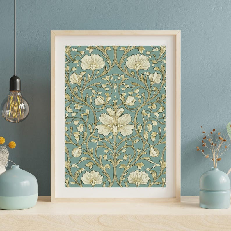 May include: A framed print of a vintage floral pattern with white flowers and gold leaves on a teal background.
