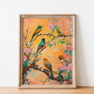 May include: A framed painting of a floral scene with four birds perched on branches. The birds are blue, green, orange, and yellow with black accents. The flowers are pink and white with green leaves. The background is a soft orange.
