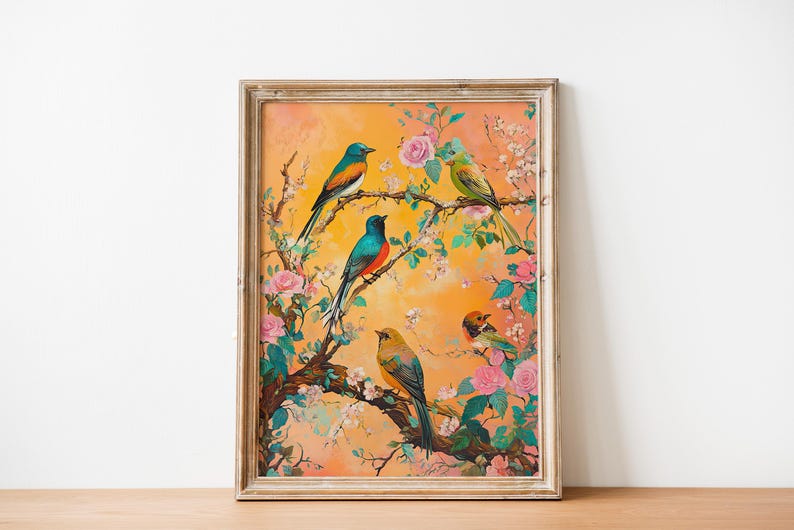 May include: A framed painting of a floral scene with four birds perched on branches. The birds are blue, green, orange, and yellow with black accents. The flowers are pink and white with green leaves. The background is a soft orange.