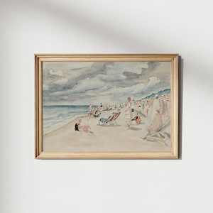 Könnte beinhalten: Ein Aquarellbild, das eine Strandszene mit Menschen zeigt, die sich auf dem Sand und in Stühlen entspannen. Der Himmel ist bewölkt und das Wasser ist hellblau. Das Bild ist in einem hellen Holzrahmen gerahmt.