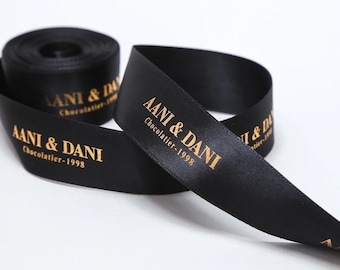 May include: Black satin ribbon with gold lettering that reads "AANI & DANI Chocolatier - 1998".