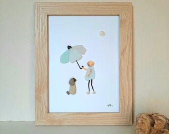May include: A framed artwork made of sea glass depicting a person holding an umbrella over a dog. The artwork is on a white background with a light blue umbrella, a light blue and orange person, and a brown dog.