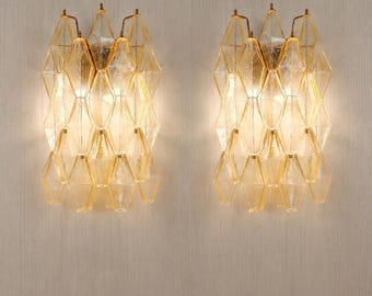 Set of two Murano glass poliedri wall sconce in light amber color