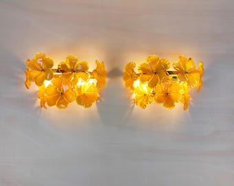 Pair of Murano glass wall sconces with amber flowers