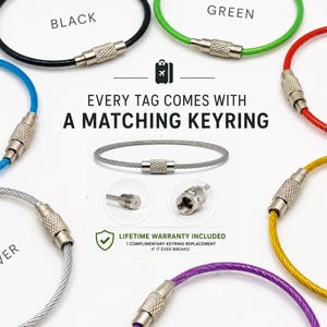 May include: A selection of colourful keyrings in black, blue, green, red, gold, silver, and purple. Each keyring has a metal clasp. The text reads "EVERY TAG COMES WITH A MATCHING KEYRING" and "LIFETIME WARRANTY INCLUDED".