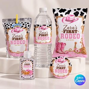 May include: A Capri Sun pouch, a water bottle, a snack bag, a hand sanitizer bottle, and a circular label, all featuring a cow print border, a pink cowboy hat, and the text Zara's FIRST RODEO with pink lettering and gold rope accents.