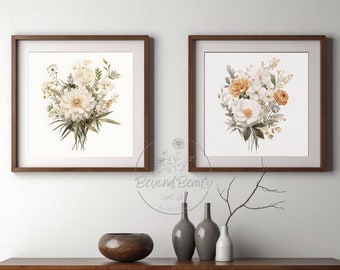 May include: Two framed watercolor paintings of floral bouquets. The bouquets are in shades of white, cream, and orange. The paintings are hanging on a white wall above a wooden shelf with decorative vases.
