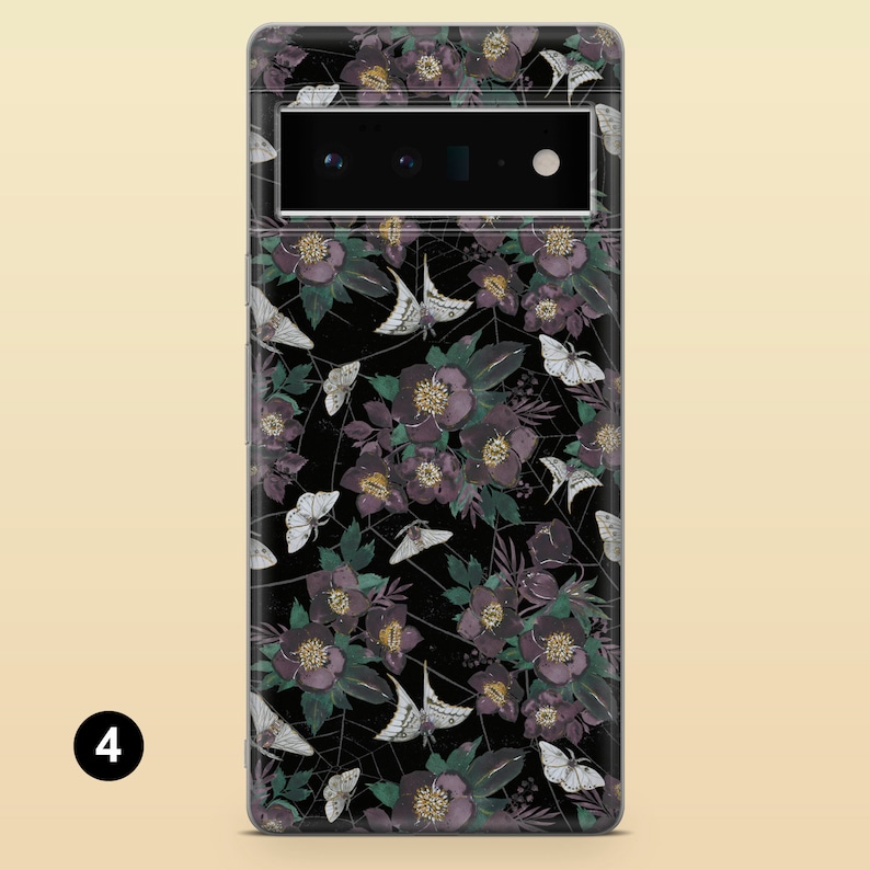 May include: A black phone case with a floral pattern featuring purple flowers, white butterflies, and a spiderweb design.