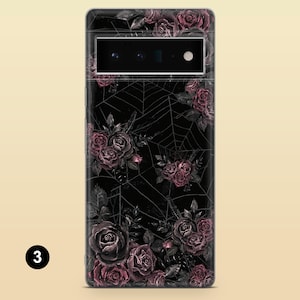 May include: Black phone case with a floral design featuring dark pink roses and a spiderweb pattern.