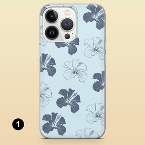 May include: A clear phone case with a light blue background and a pattern of dark blue hibiscus flowers.