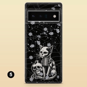 May include: Black phone case with a white skeletal cat design, a skull, and floral accents on a black spiderweb background.