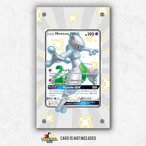 May include: A framed Mewtwo GX Pokémon card. The card features a white and purple Mewtwo character with green accents. The card is displayed in a clear acrylic frame with silver fixings. The text "CARD IS NOT INCLUDED" is at the bottom.