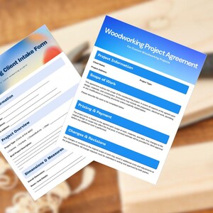May include: Two printed forms titled "Woodworking Client Intake Form" and "Woodworking Project Agreement" with blue and white text. The forms are on a wooden surface with a hammer visible in the background. The forms include sections for client information, project overview, and dimensions.