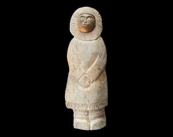 Signed Inuit bone and stone carving of a mother with child on her back