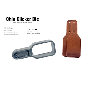 May include: A gray plastic bottle-shaped clicker die with two holes on the side. Two brown leather bottle-shaped clicker dies are shown on the right side of the image. The text "Ohio Clicker Die" is at the top of the image. The text "Built Tough - Made to Last" is below the title. The text "Kyle Sindlinger" is in the lower left corner of the image. The text "(330) 317-2492" is below the name. The text "sales@ohioclickerdie.com" is below the phone number. The text "www.ohioclickerdie.com" is below the email address. The text "8031 E. Lincoln Way" is in the lower right corner of the image. The text "Apple Creek OH 44606" is below the address. The text "Ohio Clicker Die" is at the top of the image. The text "Built Tough - Made to Last" is below the title.