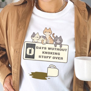 Funny cat shirt, 0 days without knocking stuff over, humorous cat T-shirt, cat lovers shirt, cute cat tee, funny short sleeve graphic tees