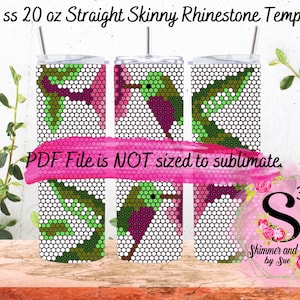 May include: Three 20 ounce straight skinny tumblers with a hummingbird design in green, pink, and purple rhinestones. The tumblers are on a wooden surface with green plants in the background. The text "PDF File is NOT sized to sublimate." is on a pink background.