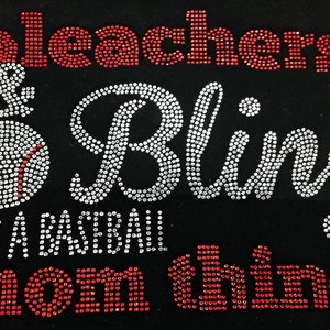 May include: A black t-shirt with red and white rhinestones spelling out "bleachers & bling it's a baseball mom thing".